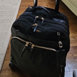 Tumi Black Rolling Bag/Carry On with Gold Accents